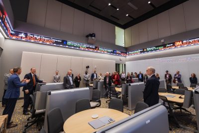 People stand in a large room 