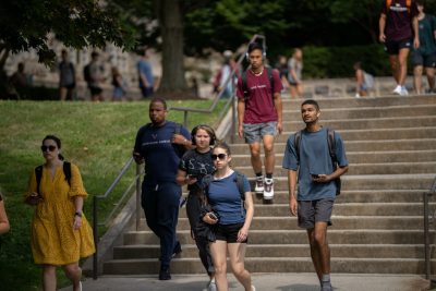 Students walking down steps during a class change. 