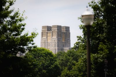 The top of Burruss Hall among the trees. 