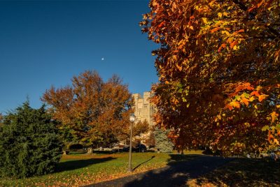 Leaves changing colors for the fall with Burruss Hall.
