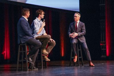 President Sands talks with two presidential postdoctoral fellows, Eduardo Camps and Blake Caldwell, at the State of the University Address.
