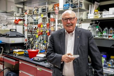 Photo of Dennis Dean in a lab