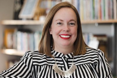 Photo of Frances Keene, interim vice president of Virginia Tech Student Affairs, posing outside and smiling