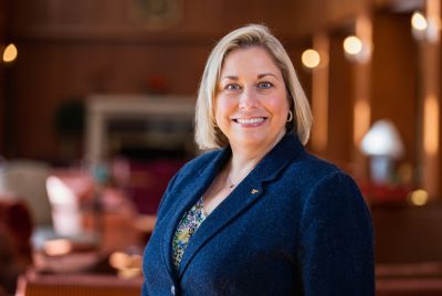 Photo of Frances Keene, interim vice president of Virginia Tech Student Affairs, posing outside and smiling